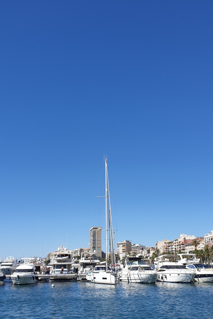 White boats floating on the Mediterranean sea, Alicante's port