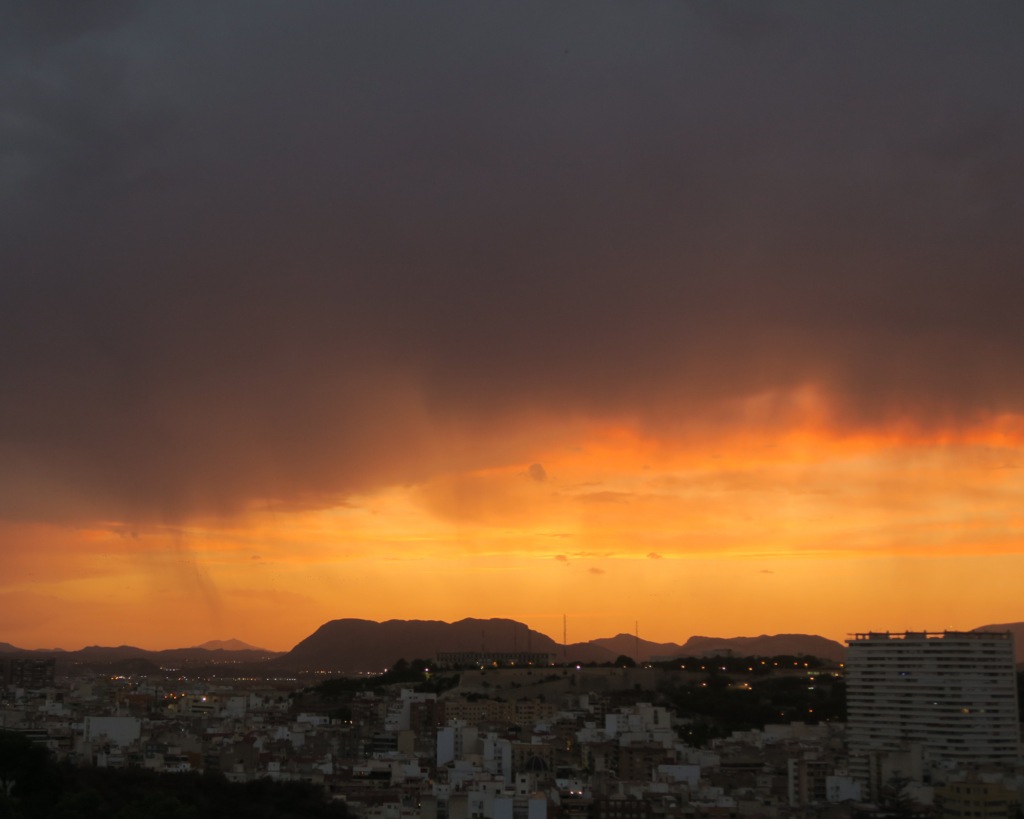 Stunning sunset in Alicante, Spain. View from Castillo de Santa Barbara. The sky is on fire.