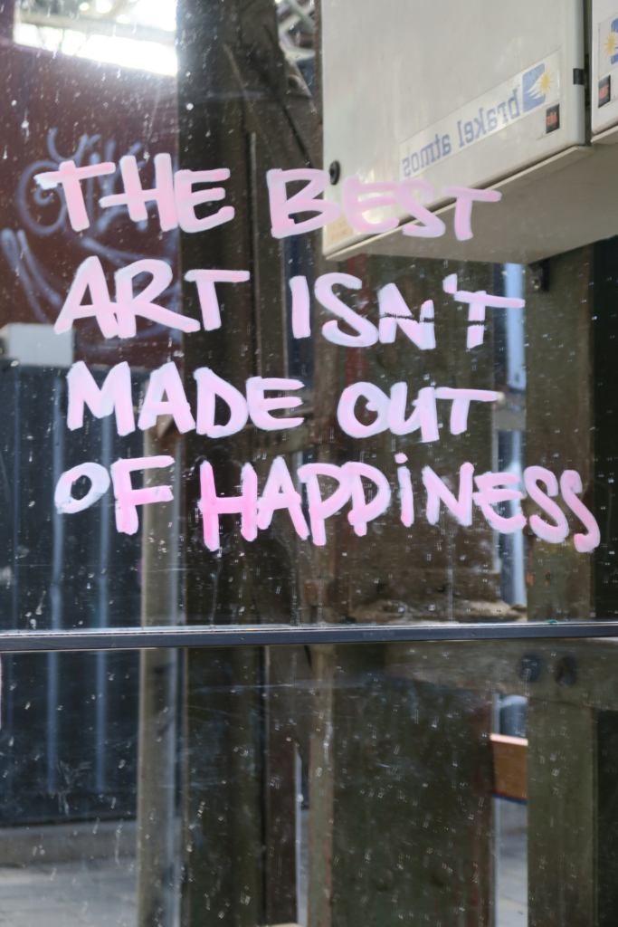 Quote "the best art isn't made out of happiness" NSDM in Amsterdam, the Netherlands